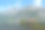 这张照片捕捉了挪威宁静的峡湾风景，展现了高耸的绿色山脉和静谧的倒影水面。图片下载