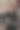 年轻女子在现代厨房中微笑着手握新家钥匙，庆祝成功购房和拥有自己家的喜悦。竖版照片图片下载