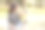 在日本的一个阳光明媚的森林公园里，一位三十多岁的日本妈妈坐在长椅上，给她六个月大的宝宝喂奶。这张照片捕捉了一个安静而温馨的户外家庭时刻。图片下载
