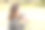 在日本的一个阳光明媚的森林公园里，一位三十多岁的日本妈妈坐在长椅上，正在给她六个月大的宝宝喂奶。这张照片捕捉了一个安静而温馨的户外家庭时刻。图片下载