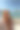 特写的竖版照片，展示一位有雀斑的女性坐在海滨长廊上，凝视着风景。图片下载