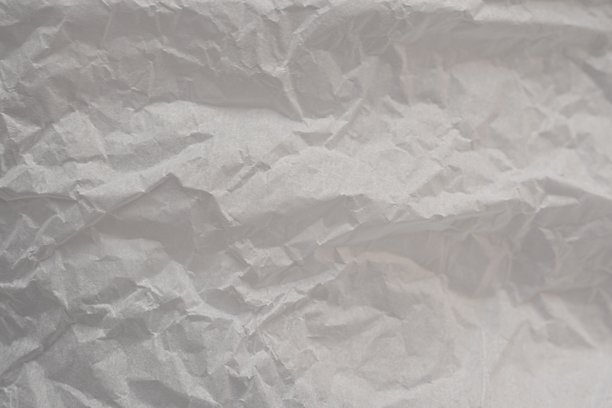 灰色皱纹纸质感作为背景，旧牛皮纸作为背景，皱纹包装材料质感作为背景照片。图片下载