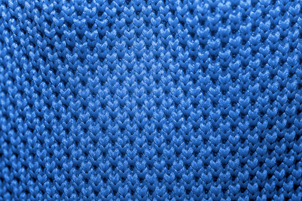 粉色运动鞋网眼纹理的特写照片。微距摄影图片下载