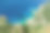 扫描的历史彩色照片，展示了希腊科孚岛帕莱奥卡斯特里察沿海地区的岩石和山脉，阳光明媚。图片下载