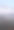 春季风景。美丽的海湾晨曦全景。明亮的光线下，水面上漂浮着积云。海岸线上有冰雪和岩石。阳光的光芒在海面上反射。竖版照片图片下载