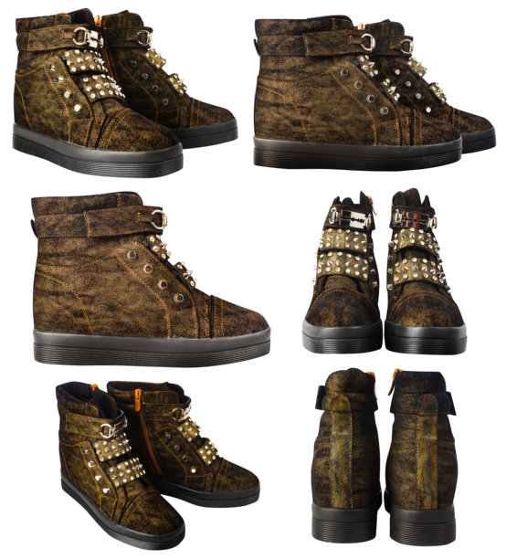 白色背景上的棕色绒面革女式摇滚或朋克靴子的孤立照片。图片下载