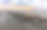 美丽的照片展示了地中海海面上岩石的日落倒影。图片下载
