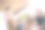 低角度拍摄的照片，展示了一位男性领导者（CEO）与同事们开会，快乐的微笑着，大家在户外鼓掌工作。图片下载