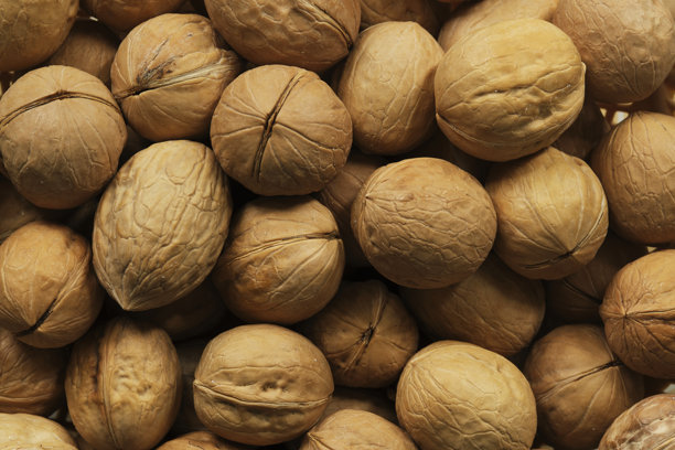 特写微距照片中核桃的背景。图片下载