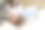 怀孕。准备婴儿房和在线购物。孕妇抱着笔记本电脑，拥抱着肚子，站在婴儿床旁，周围有衣物和玩具。图片下载