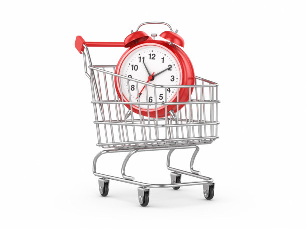 红色模拟时钟在购物车与孤立的白色背景，发薪日，购物日或促销概念股票照片图片下载