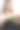 年轻女性在家中舒适地坐在沙发上阅读一本书，享受宁静的休闲时光，沉浸在文学中。竖版照片图片下载