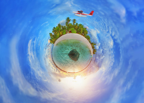 水上飞机飞越马尔代夫岛，宛如一个世界地球仪。关于旅行概念的照片插图。图片下载