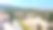 贝拉帕伊斯修道院和传统塞浦路斯村庄的鸟瞰图，周围环绕着郁郁葱葱的绿树和山坡，位于北塞浦路斯基尔尼亚，适合旅行和纪录片使用的历史建筑和文化遗产照片。图片下载