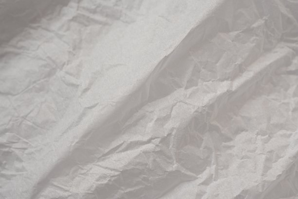 灰色皱纹纸质感作为背景，旧牛皮纸作为背景，皱纹包装材料质感作为背景照片。图片下载