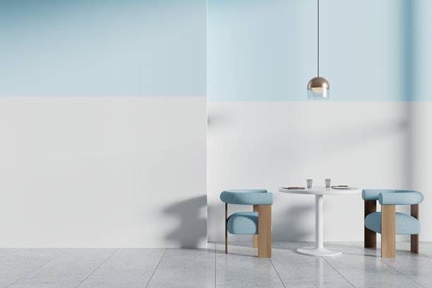 舒适的咖啡馆内部有圆桌和柔软的椅子。模型墙图片下载