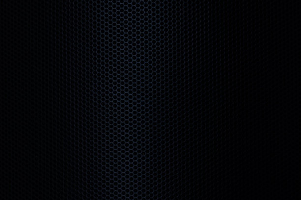 黑色宏观科技背景，扬声器网格纹理，黑暗中楼梯状结构墙板的磨损特写照片。关于现代建筑、室内、工业或科技的黑白抽象纹理背景。图片下载
