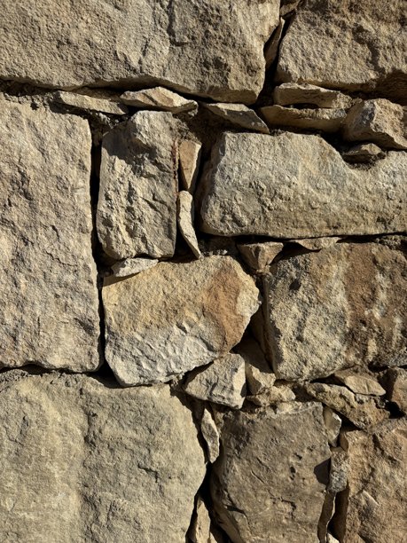 石墙照片，纹理背景。乡村风格石墙的特写。图片下载