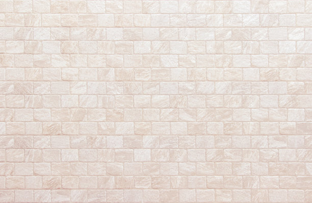现代奶油砖墙背景照片细节。棕色砖墙纹理背景，适用于石材瓷砖块的涂装设计。图片下载