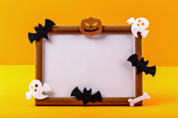 万圣节照片框，背景为鲜艳的橙色，装饰有幽灵和蝙蝠。图片下载