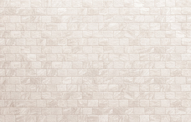 现代奶油砖墙背景照片细节。白色砖墙纹理背景，适用于涂成米色的石材瓷砖块，现代室内和室外背景设计。图片下载