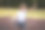 照片中的小女孩面带笑容，在公园里玩耍，她的一只手臂打着石膏，享受着户外活动。该照片描绘了一个充满活力和快乐的场景，突出了孩子们在日常生活中面对挑战时也能保持积极乐观的态度，即使在需要康复的情况下，也能享受玩耍的乐趣。小女孩的表情和公园的背景共同营造出一种温馨而积极的氛围，展现了童年的纯真与韧性。图片下载