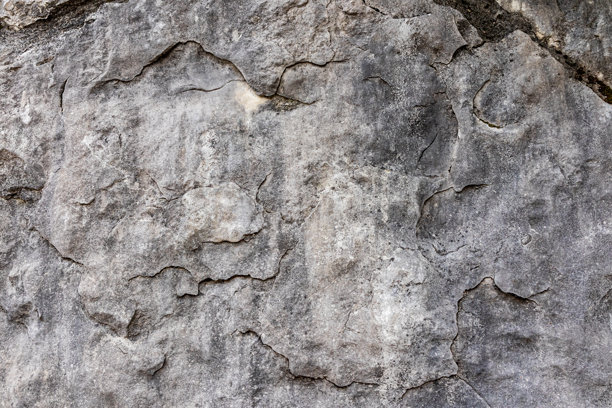 抽象的灰色石墙背景。具有自然纹理的岩石表面。天然岩石的浮雕纹理。写实照片。图片下载
