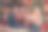 照片：一对迷人的年轻夫妇，丈夫和妻子穿着印花毛衣，微笑着在室内装饰圣诞树，在家中房间里。图片下载