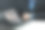 网络安全概念和安全登录系统。一位身着正装的人士正在笔记本电脑上输入，屏幕上显示虚拟锁图标。图片下载