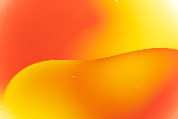 橙黄液体油滴的抽象微距照片图片下载