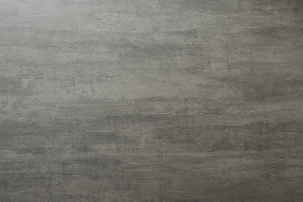 一张深灰色纹理背景的细节照片，类似粗糙的混凝土、石头或涂料灰泥，带有细微的横向磨损痕迹。图片下载