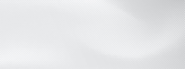浅灰色表面上的白色圆点背景。散落着圆形和斑点的抽象图案。具有半色调结构的矢量科技图形。图片下载