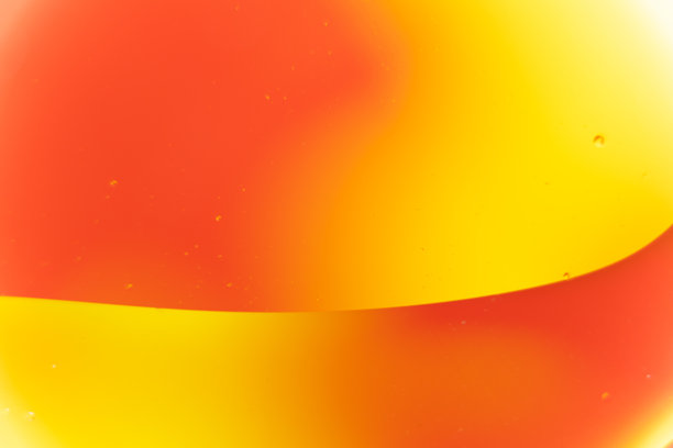 橙色和黄色液体的抽象宏观照片，带有油泡图片下载