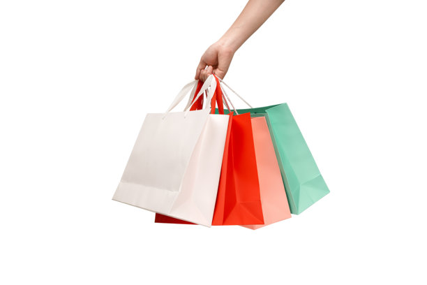 一只手拿着带提手的纸质购物袋，背景干净的白色。工作室拍摄，有充足的留白空间用于文字、标志或品牌宣传。孤立在白色背景上，抠图。图片下载