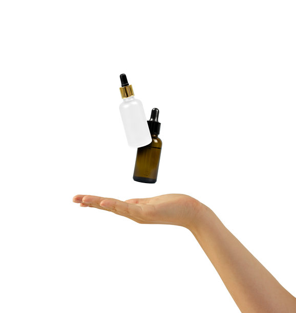 瓶子放在手掌上，专业影棚灯光展示高端化妆品，高质量的护肤品容器图片，用于在线广告和网红推广图片下载