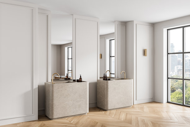 现代浴室室内，设有两个石头材质的水槽和金色水龙头，明亮的房间里有大窗户和城市景观背景。三维渲染。图片下载