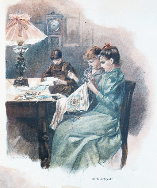 三个年轻女子在晚上的餐桌旁制作刺绣礼物图片下载