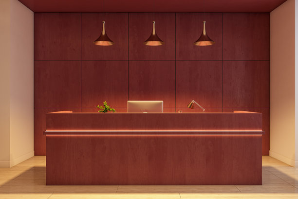 现代公司接待台，配有红色木质镶板、吊灯和柜台上的电脑，位于空旷洁净的办公室内部样机模板空间。三维渲染。图片下载