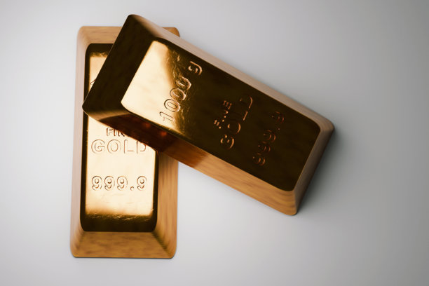 高质量照片，展示了两块抛光叠放的金条，清晰可见“FINE GOLD 999.9”纯度标记。象征全球金融储备、贵金属商品交易和强劲的经济增长。图片下载