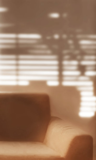 模糊的复古沙发客厅照片，呈棕褐色。图片下载