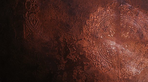 泥土铜质华丽纹理表面，灰泥复杂，浮雕东方图案。复古装饰饰面。背景氛围，设计元素，建筑可视化图片下载