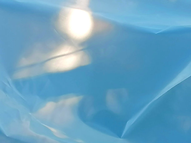 抽象的浅蓝色背景图库照片。温室膜图库照片。温室箔图库照片。防紫外线温室膜图库照片图片下载