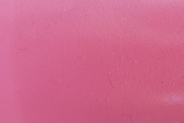粉色的背景图片表面粗糙有纹理，光线照射下显露出粗糙感。图片下载