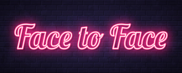 面对面 - 砖墙背景上的发光霓虹文字图片下载