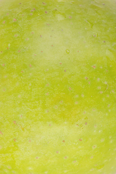 绿色苹果作为背景的宏观照片纹理。图片下载