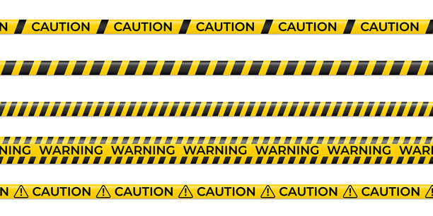 逼真的黄色封锁线，带有醒目的“小心”字样和警察封锁线图形，非常适合执法部门的视觉素材、媒体报道、紧急现场和安保图片库。图片下载