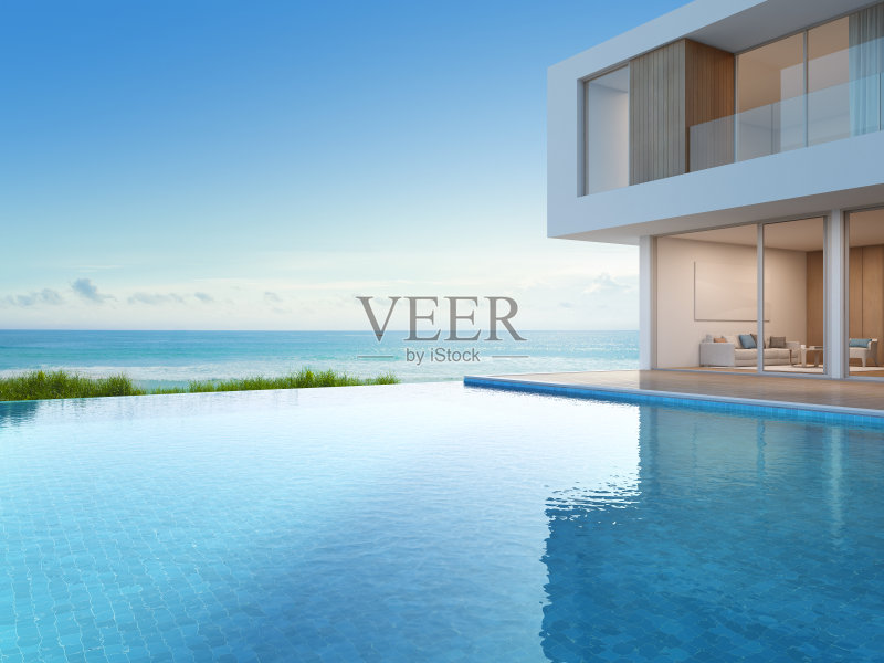 现代设计的豪华海滨别墅，海景游泳池，大家庭度假之家正版图片素材