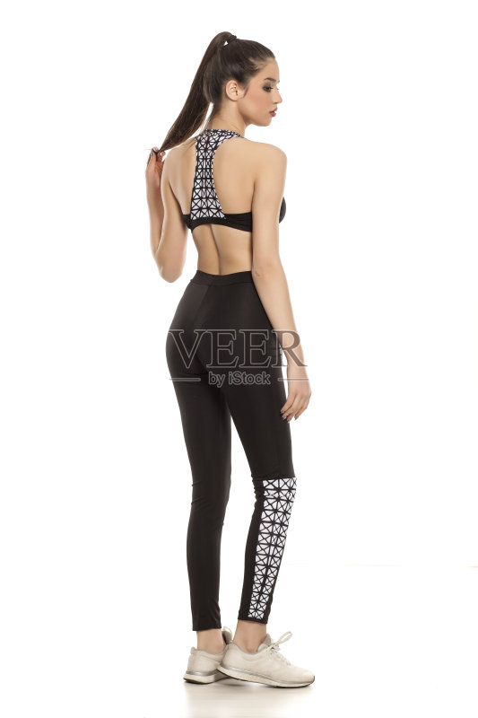 后视图的年轻女子在白色的背景运动服正版图片素材