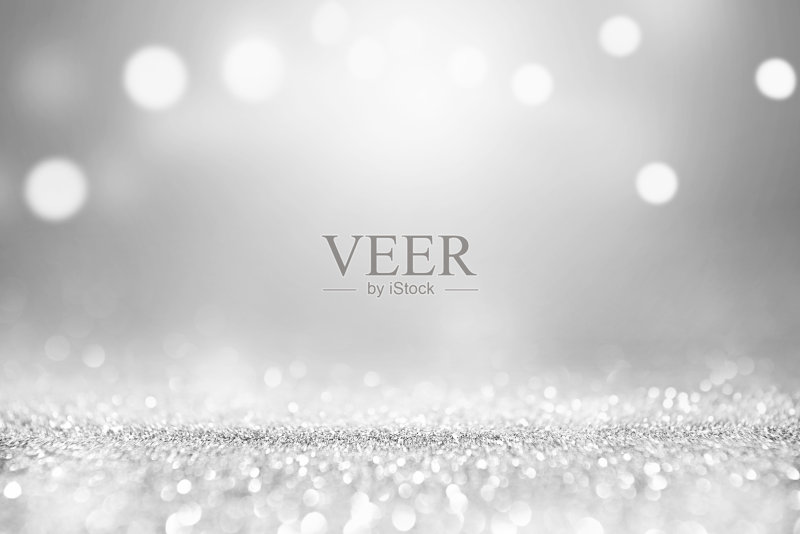 银色闪光的灯光散景背景。正版图片素材