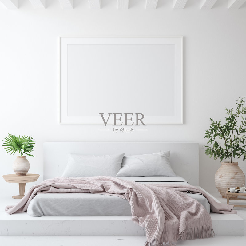 模型海报框架在白色舒适的卧室内部，斯堪的纳维亚风格正版图片素材